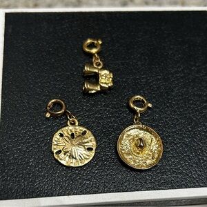 Lot of three charms for charm bracket